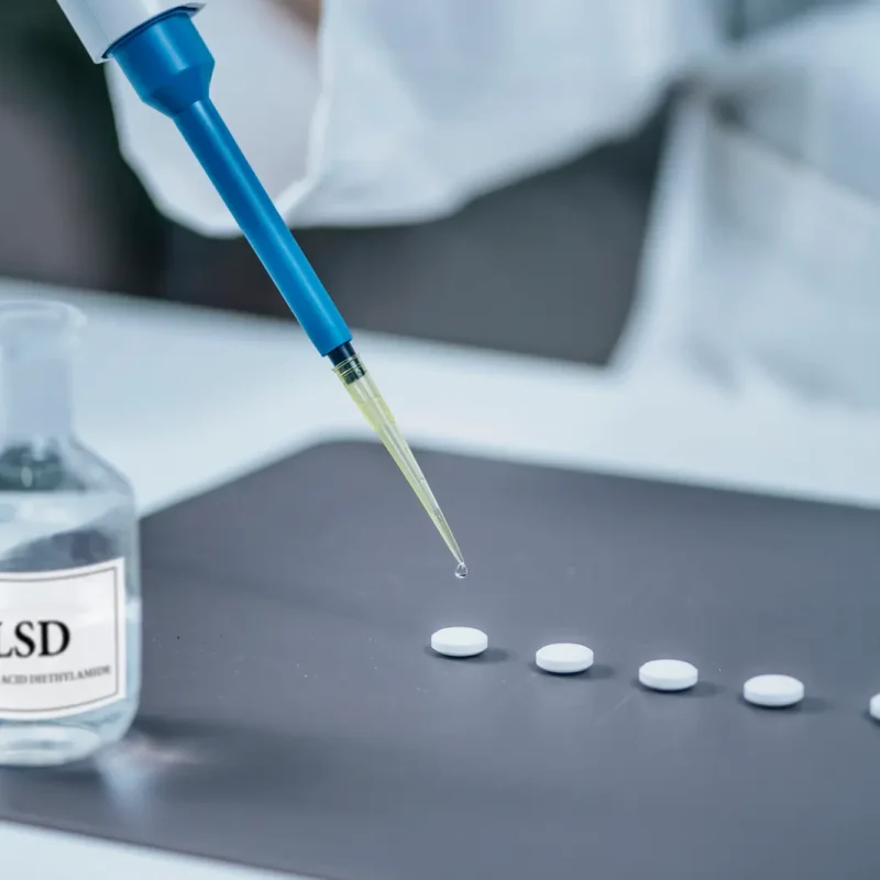 Does acid show up on a drug test. Psychedelic Drug LSD Therapy Research, Scientist Preparing Small Doses of LSD in Laboratory for drug test.